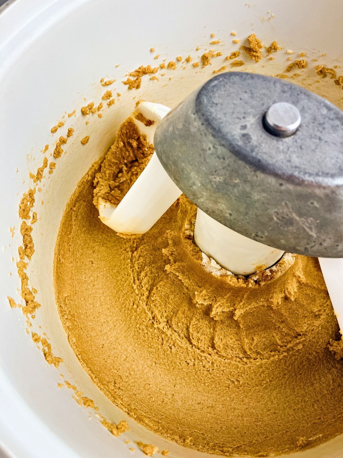 The butter, brown sugar, and white sugar are creamed together in a stand mixer bowl.
