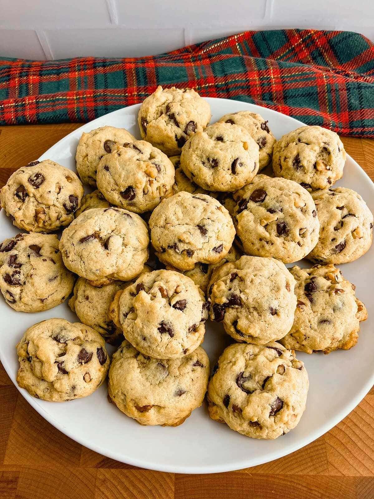 A large platter of homemade chocolate chip walnut cookies.