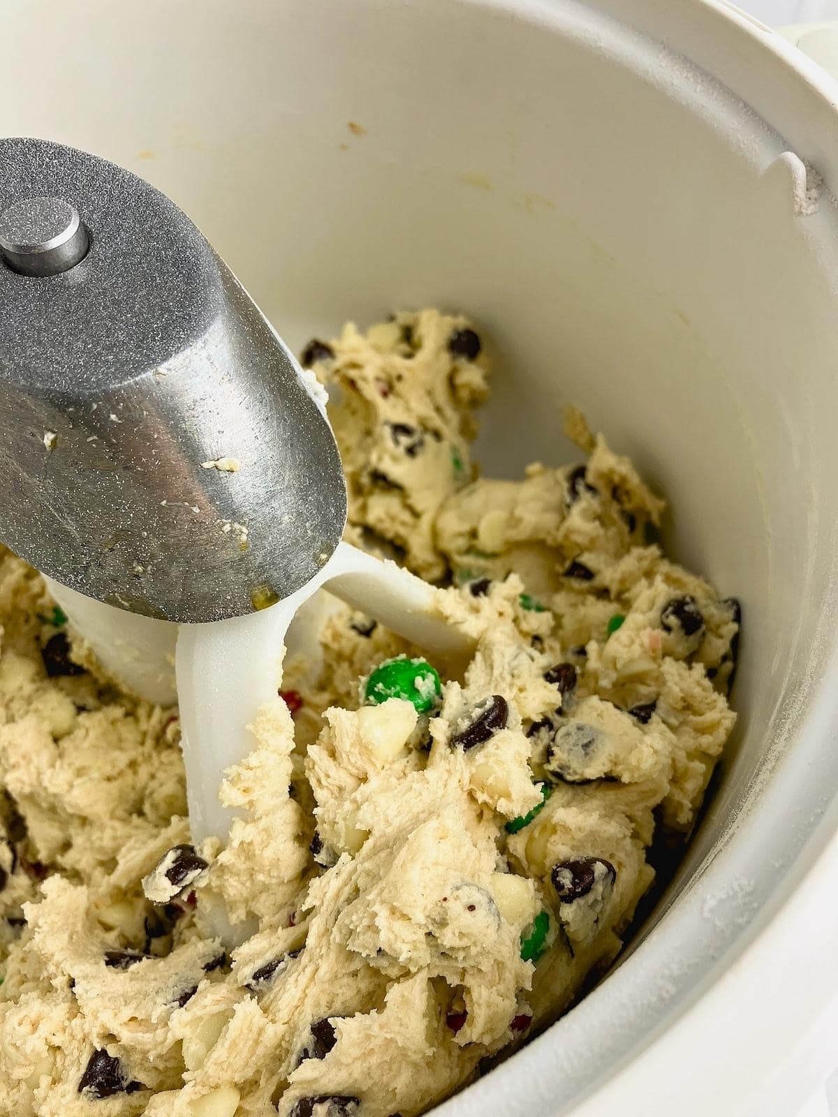 Chocolate chips and M&Ms are mixed into the cookie dough.