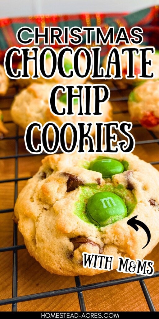 Chocolate chip cookies with M&Ms on a cooling rack. The text overlay says Christmas Chocolate Chip Cookies With M&Ms.