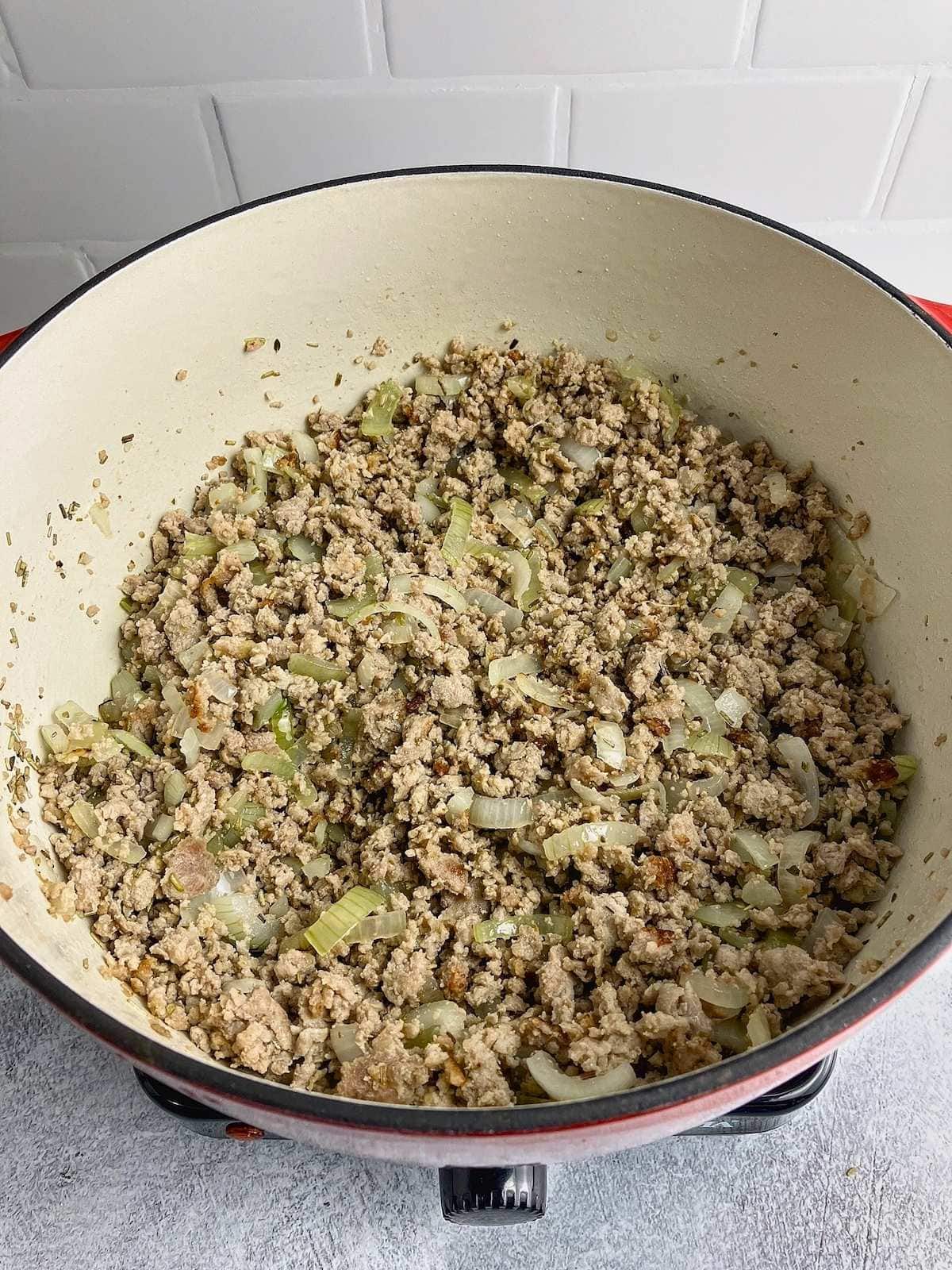 Onions cooked until soft and translucent with the pork.