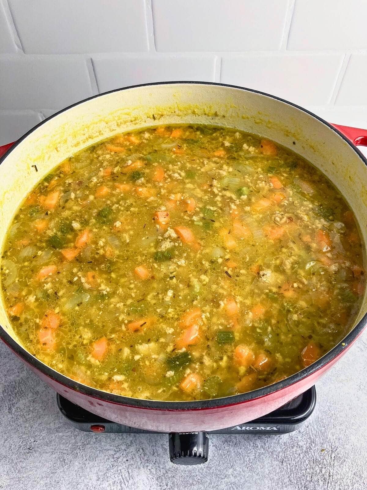 Pumpkin vegetable soup was cooked until the carrots were tender.