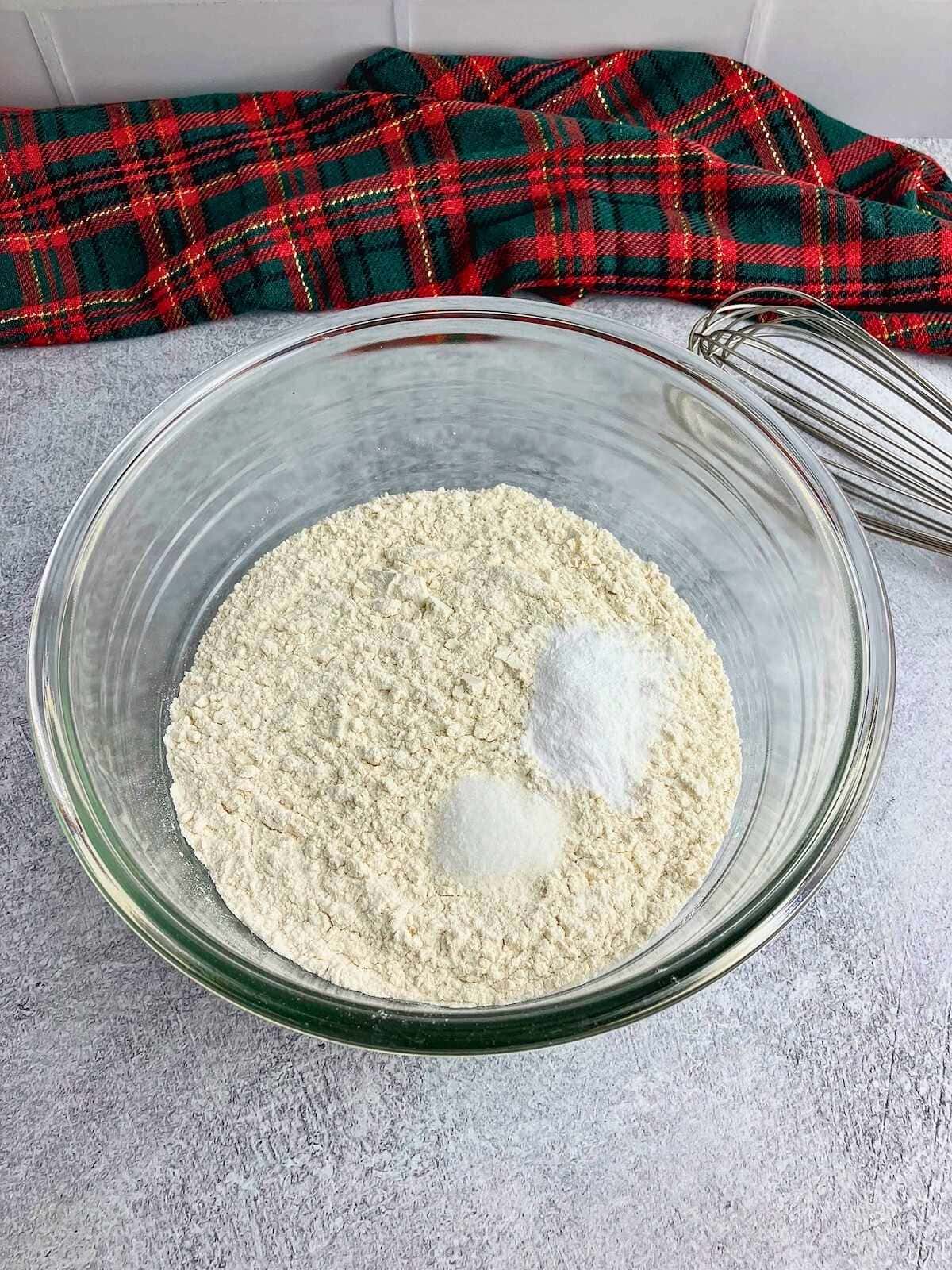 Dry ingredients in a glass mixing bowl.