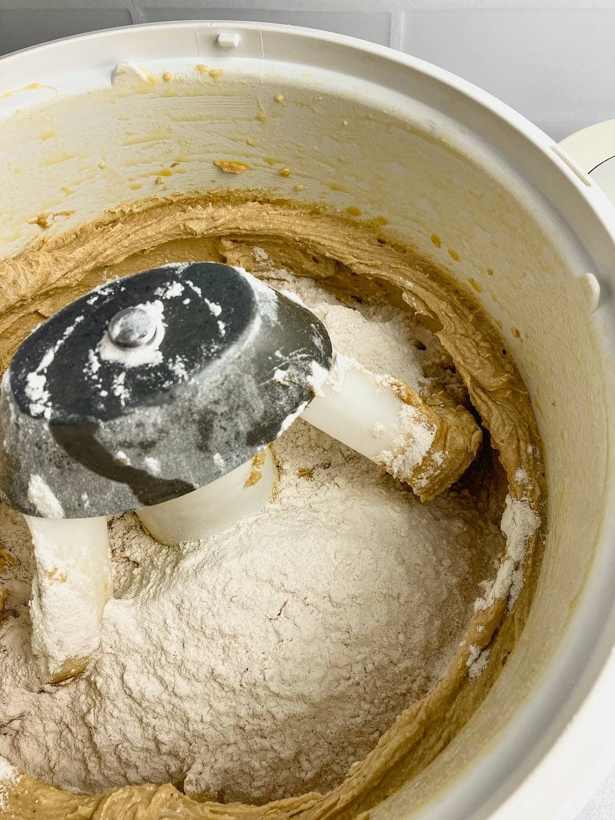 The dry ingredients have been added to the mixer bowl.