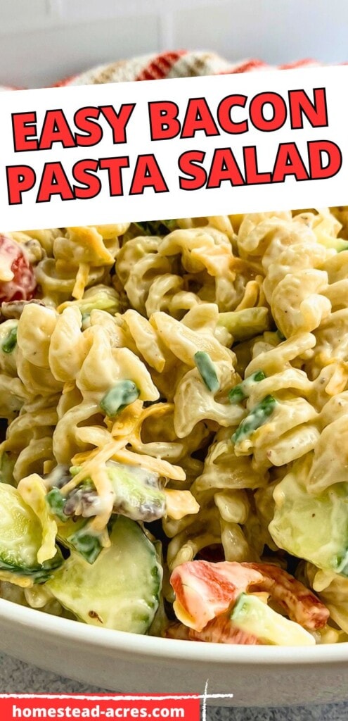 Pasta salad in a white serving bowl with bacon, veggies, and cheese. The text overlay says Easy Bacon Pasta Salad.