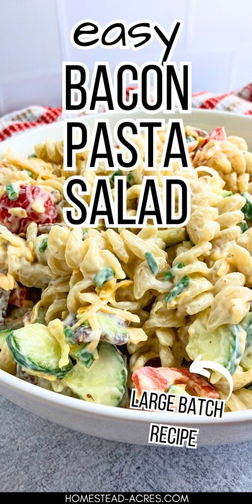 A white serving bowl filled with bacon and cheddar pasta salad. The text overlay says Easy Bacon Pasta Salad. Large Batch Recipe.
