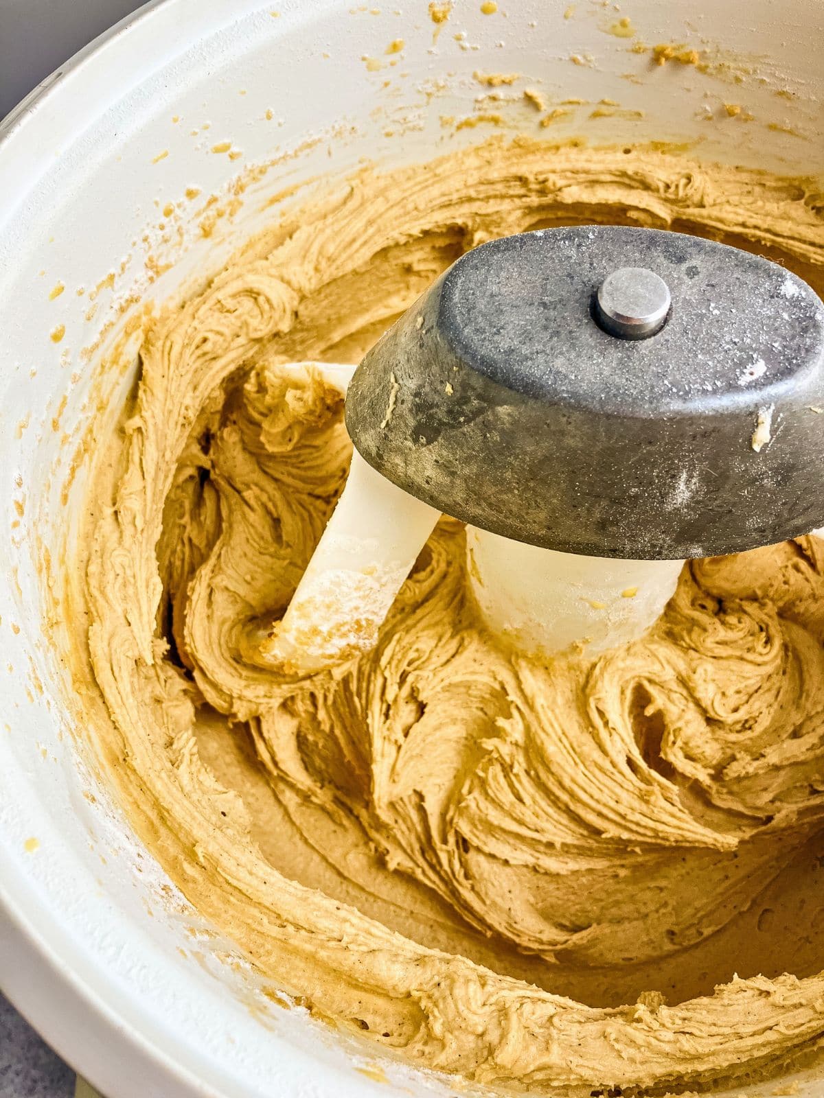 Eggnog cookie batter in a stand mixer bowl.