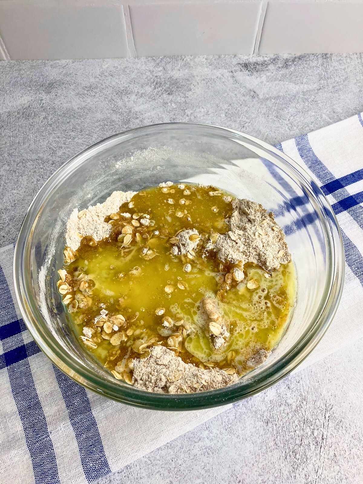 Melted butter is added to the topping mix.