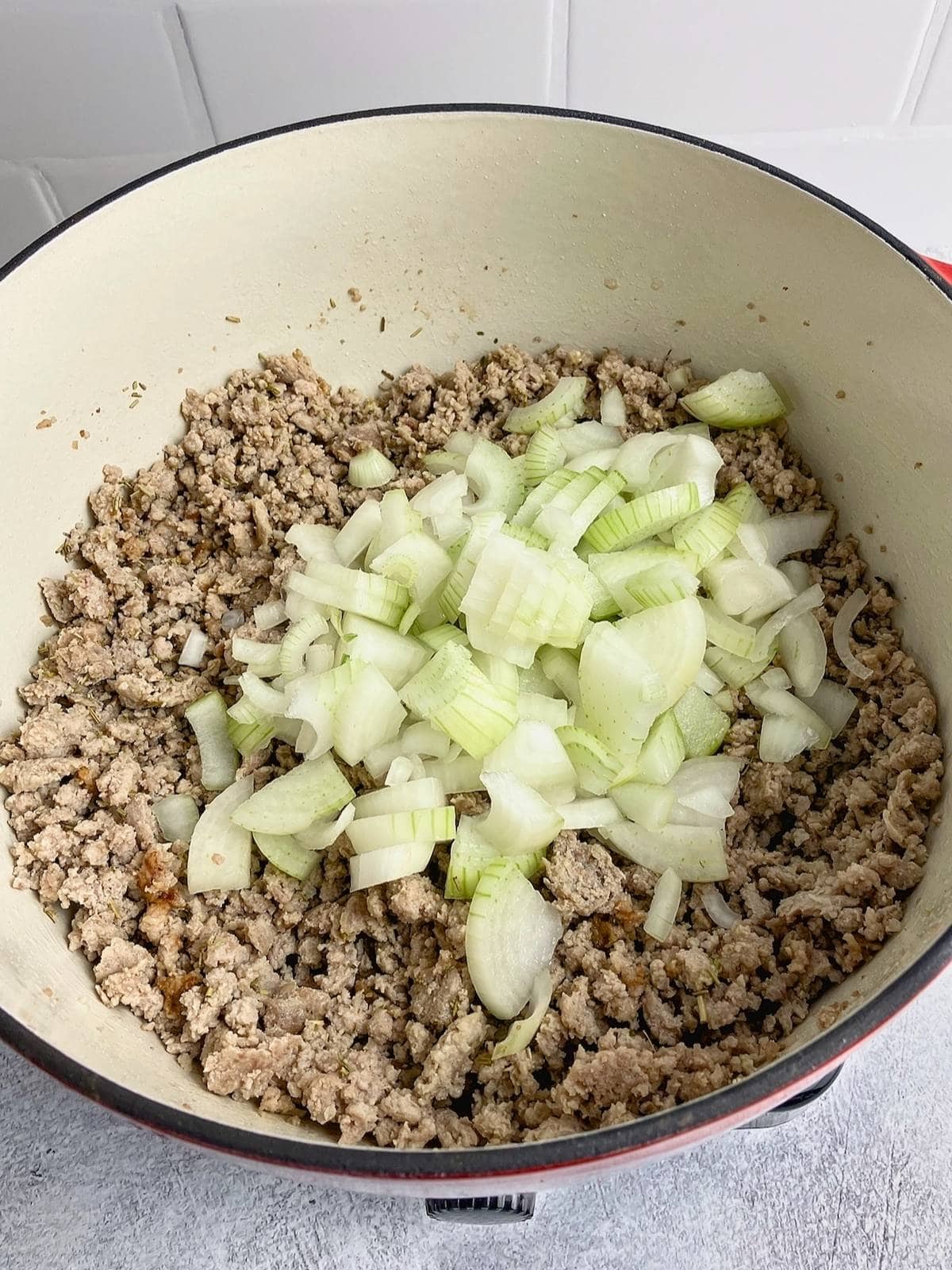 Onions were added to the cooked ground pork.