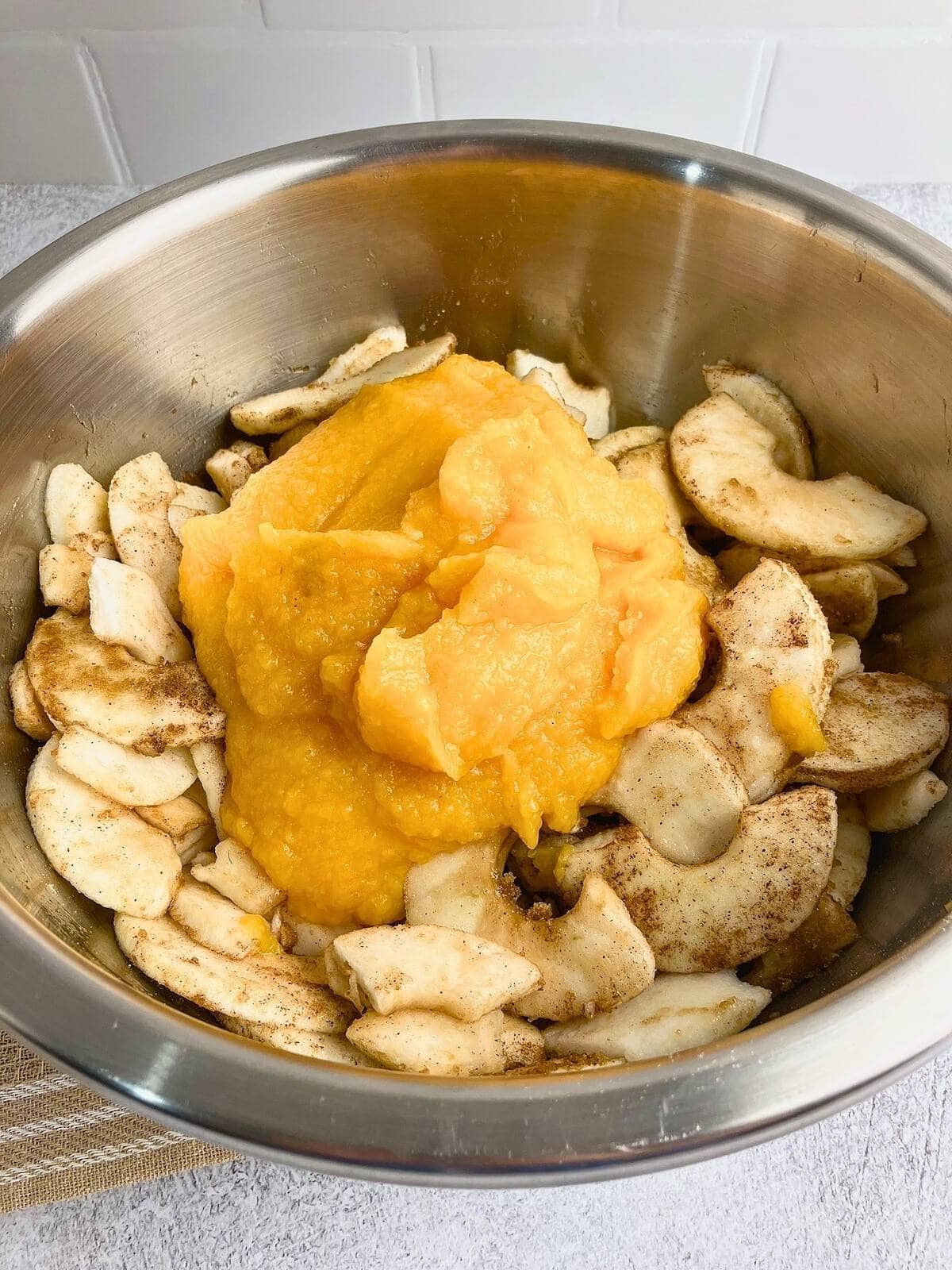 Homemade pumpkin puree added to the spiced apples.