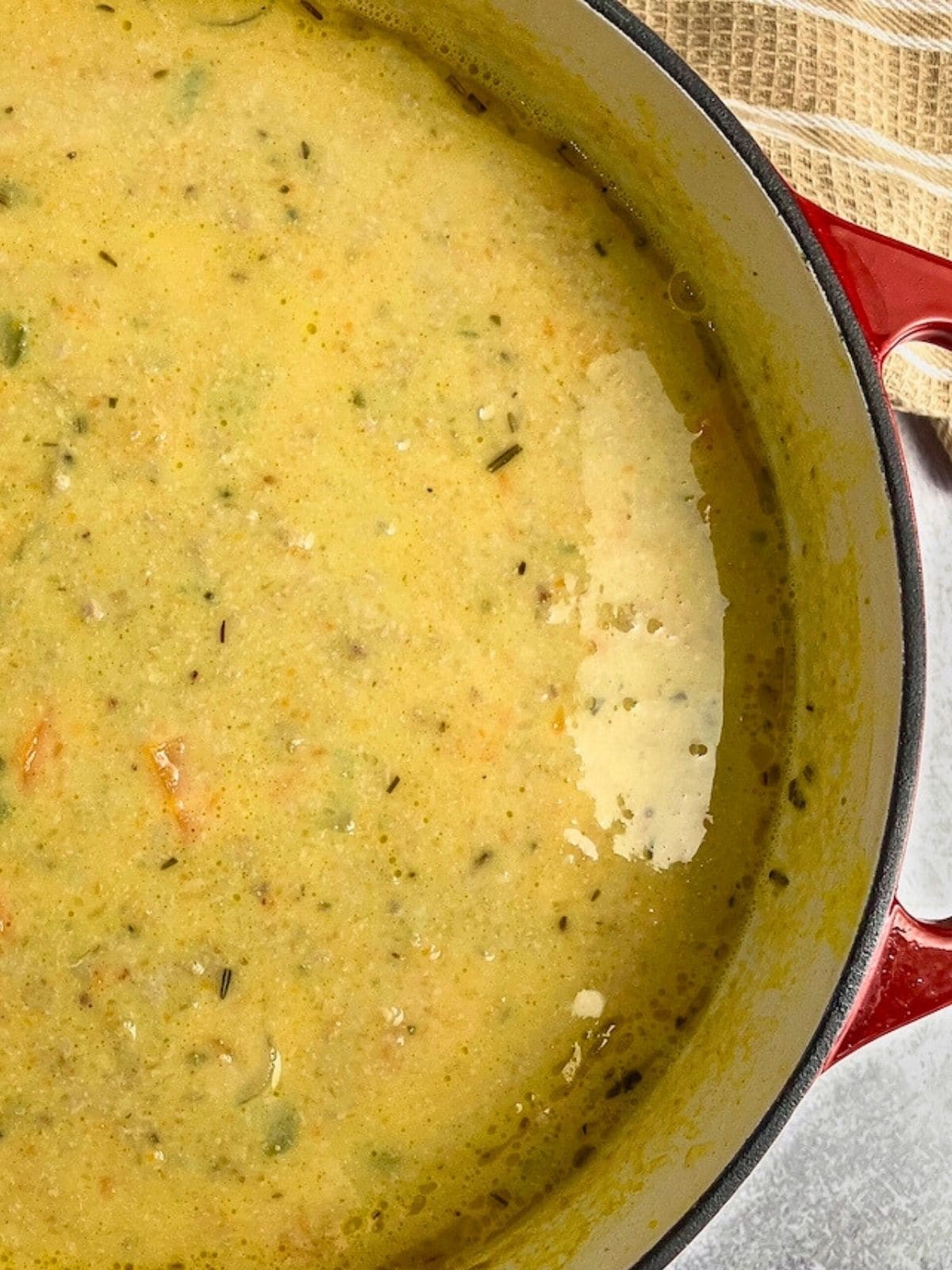 Easy pumpkin vegetable soup in a red dutch oven.