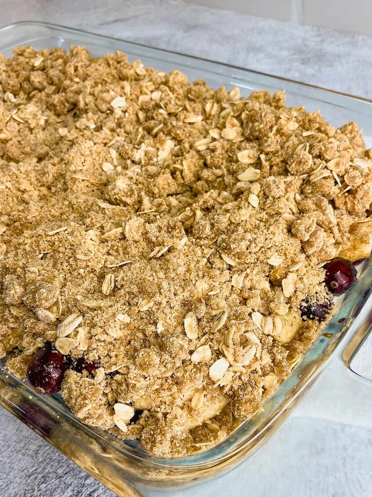 Oat topping sprinkled over the top of the fruit filling.