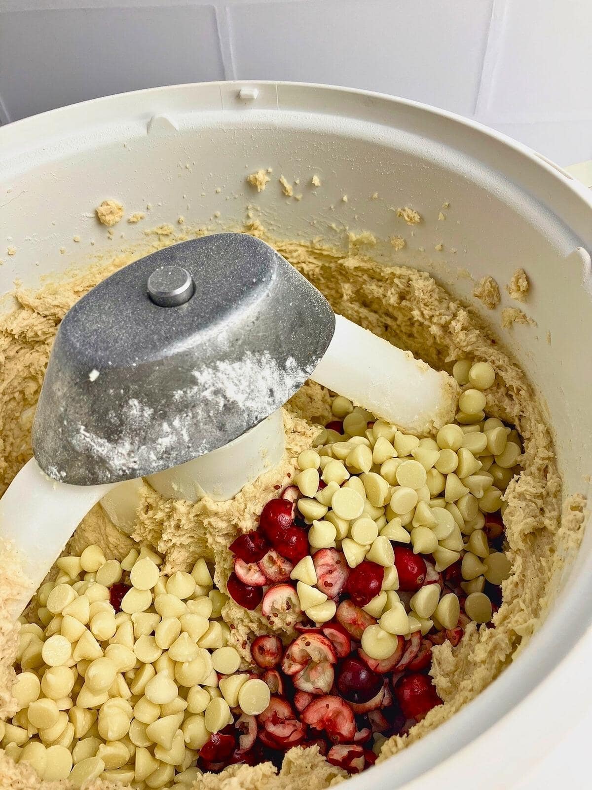 White chocolate chips and diced cranberries were added to the mixer.
