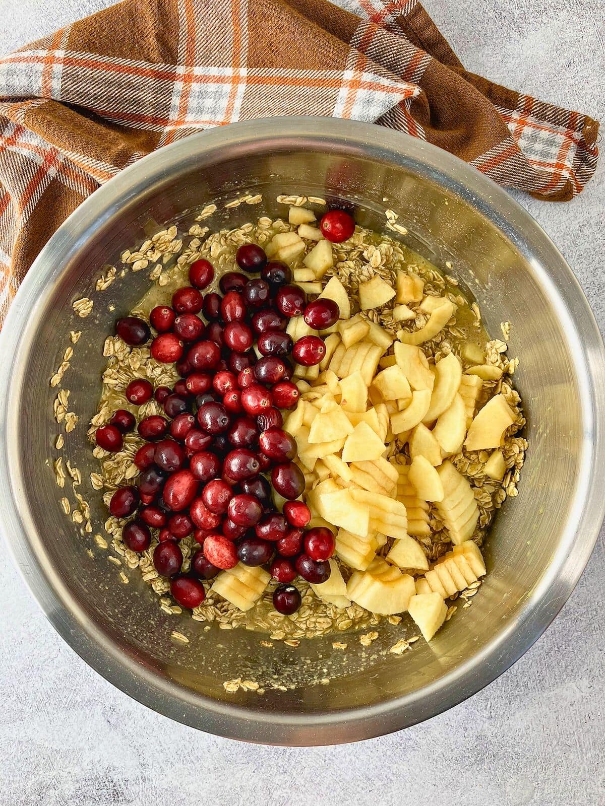 Sliced apples and cranberries were added to the bowl of batter.