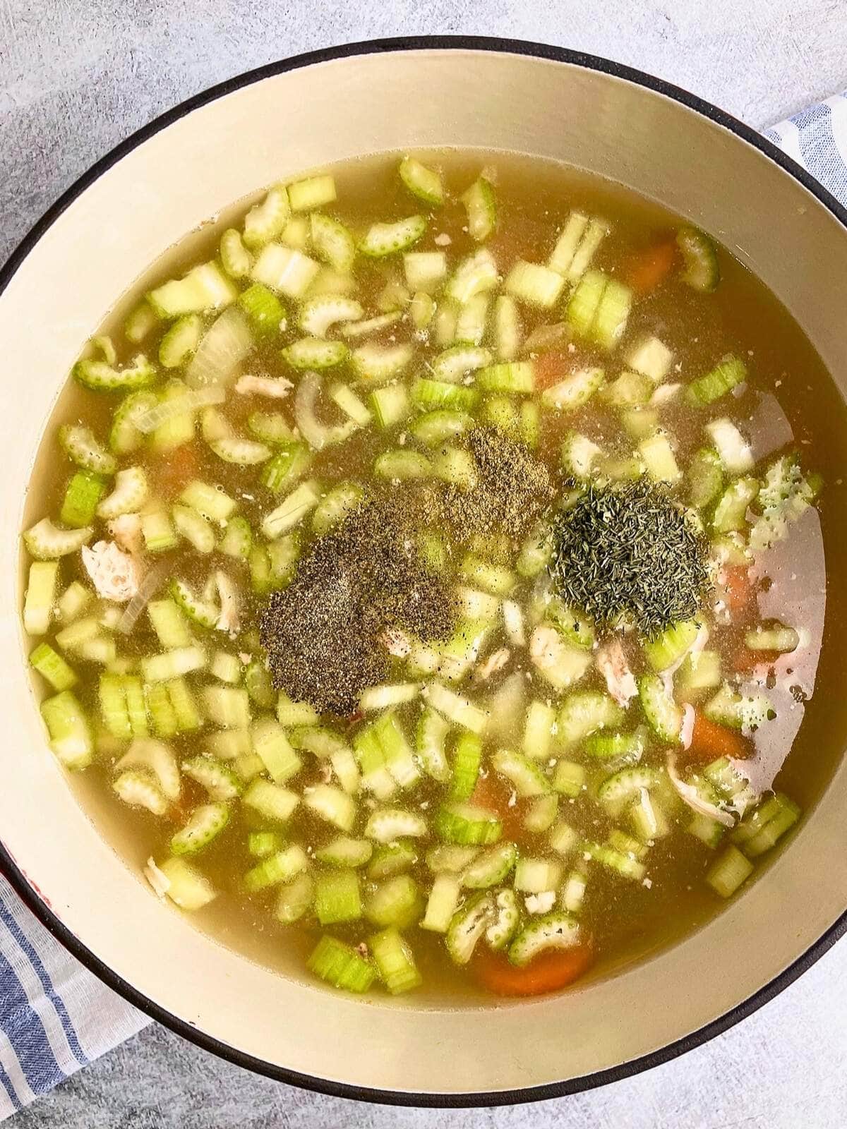 Vegetable broth and seasonings were added to the pot.