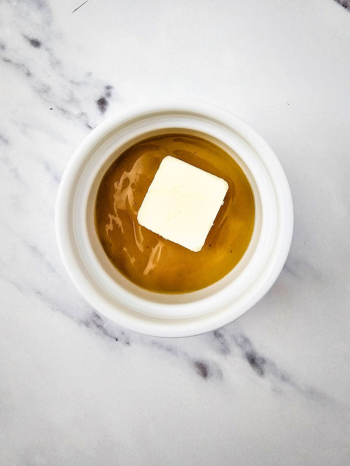 Gravy and butter in a small microwavable dish.
