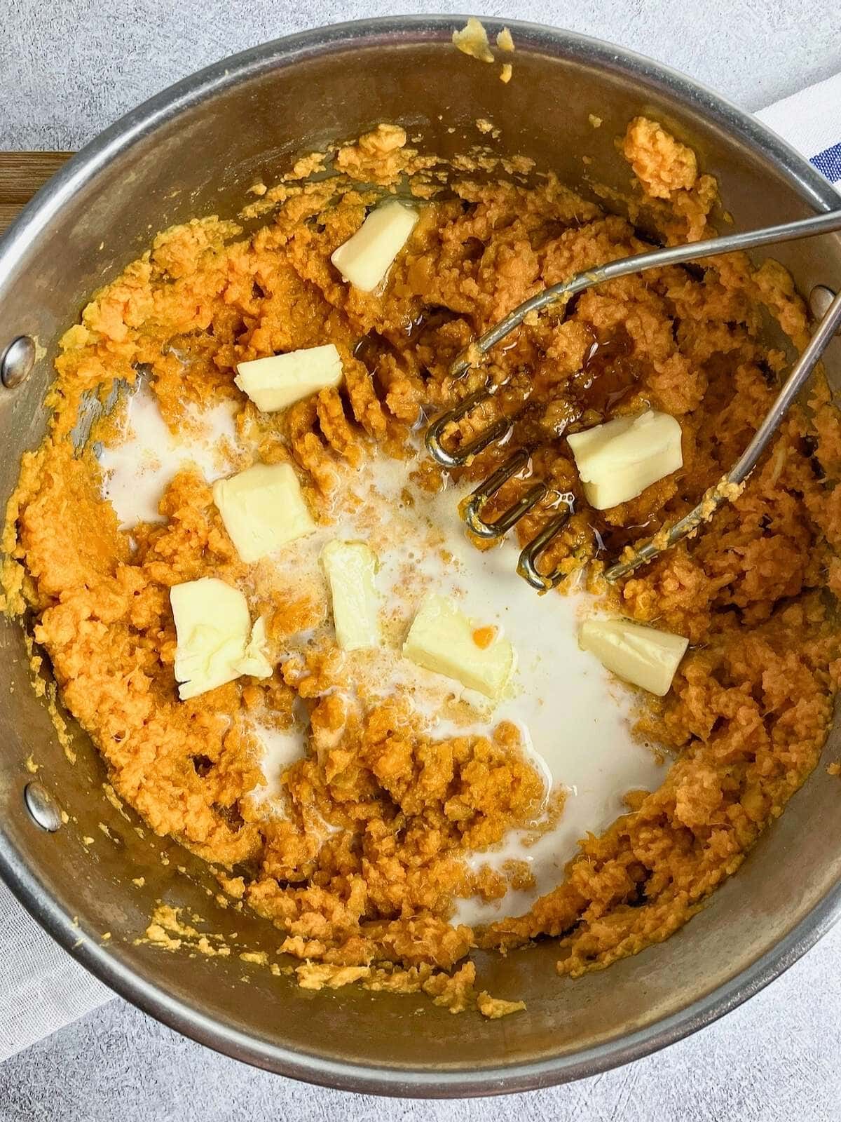Butter, milk, and maple syrup were added to the sweet potatoes.