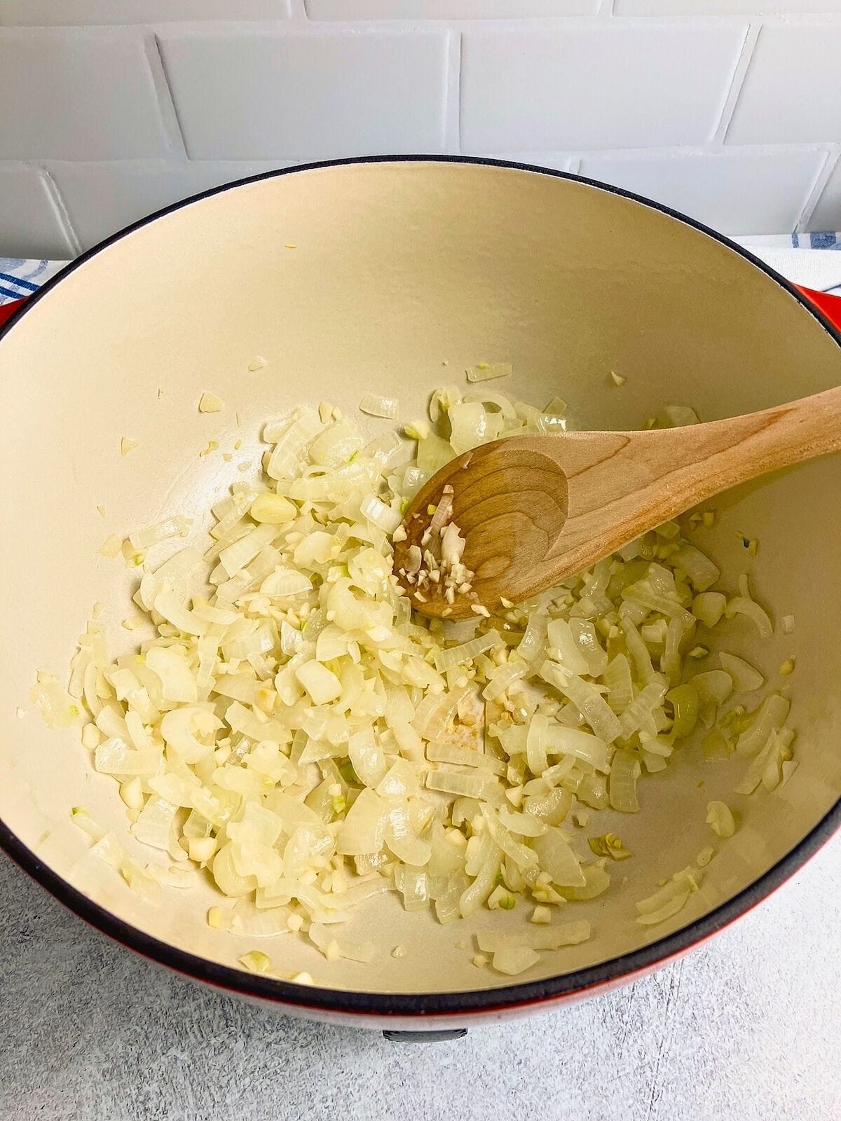 Onions and garlic are cooked in the pot.