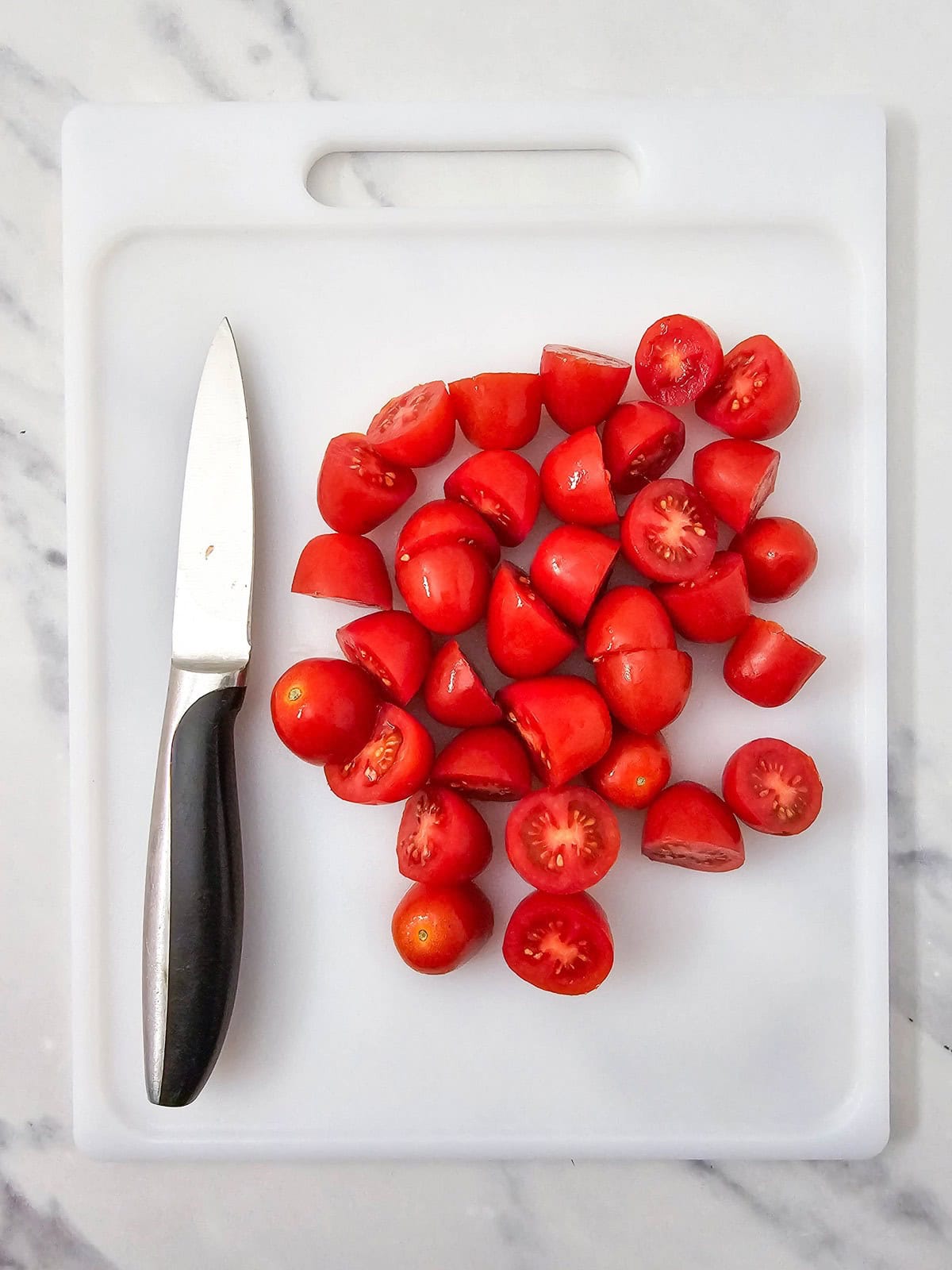 Grape tomatoes cut in half.