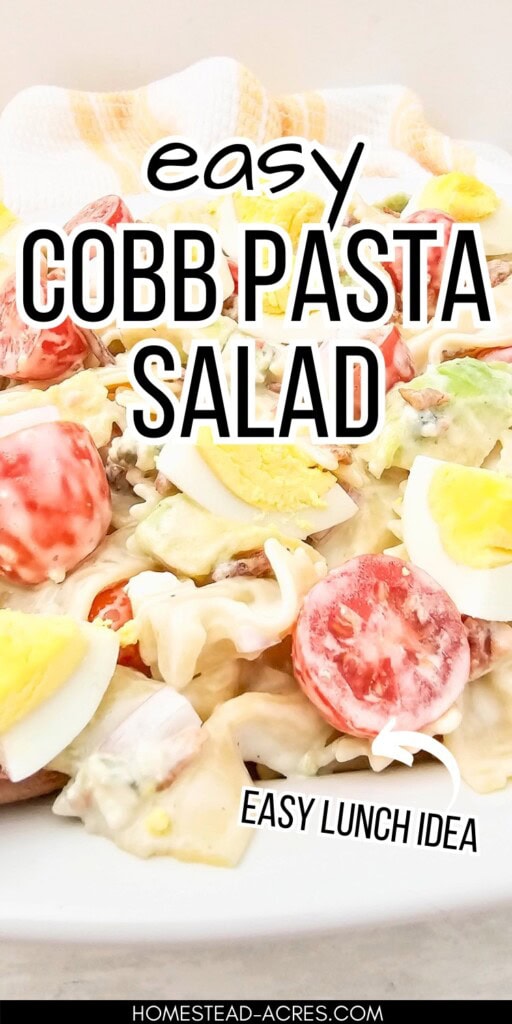 Pasta cobb salad on a serving tray. The text overlay says Easy Cobb Pasta Salad. Easy Lunch Idea.