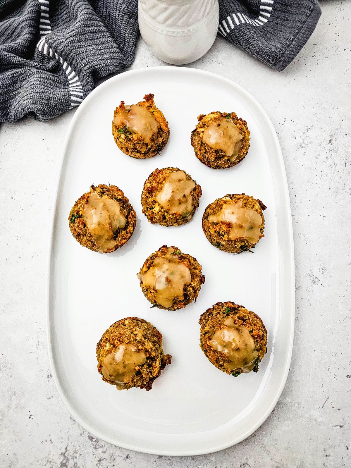 A large serving tray of stuffing muffins.