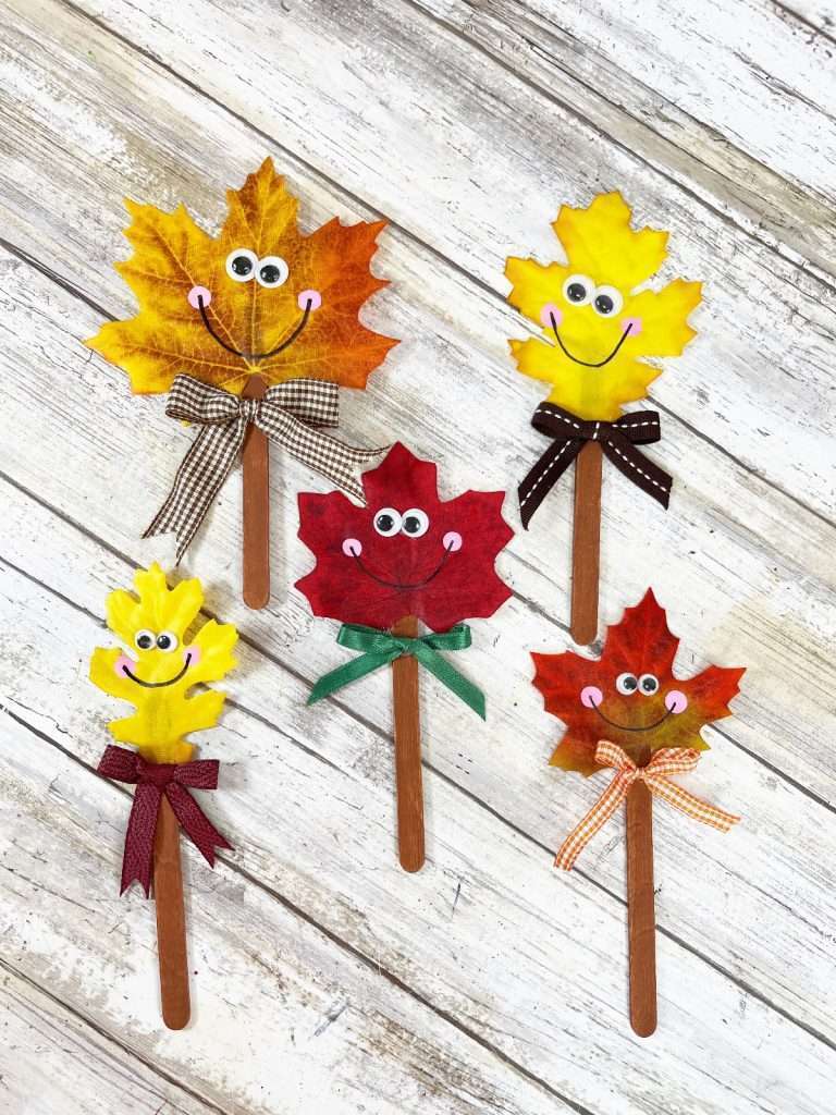 Puppets made from fake fall leaves.