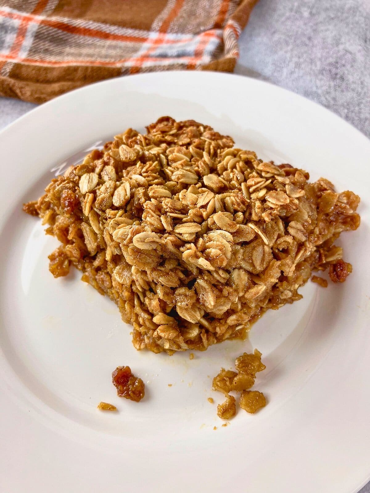 A slice of gingerbread oatmeal on a plate.