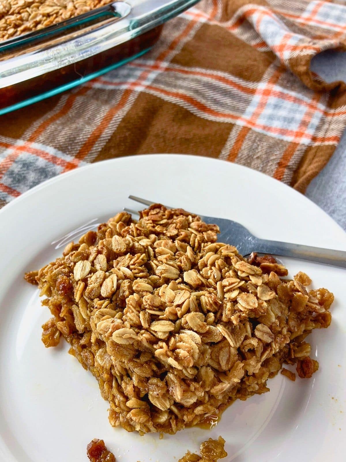 A slice of homemade gingerbread baked oatmeal on a plate.