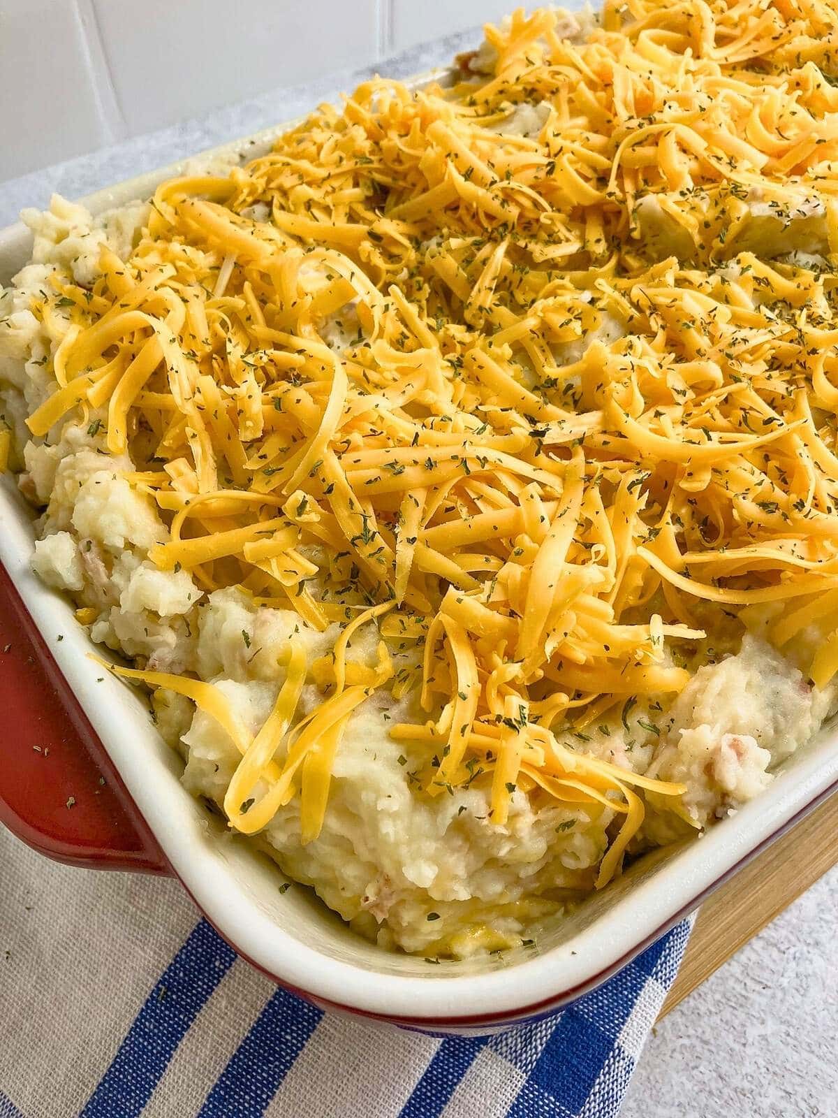 Shredded cheese sprinkled over the top of the casserole.