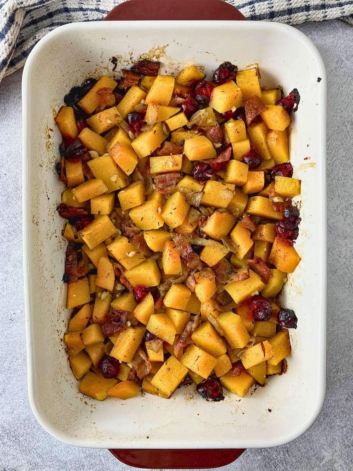 Baked maple bacon butternut squash cranberry casserole, warm from the oven.