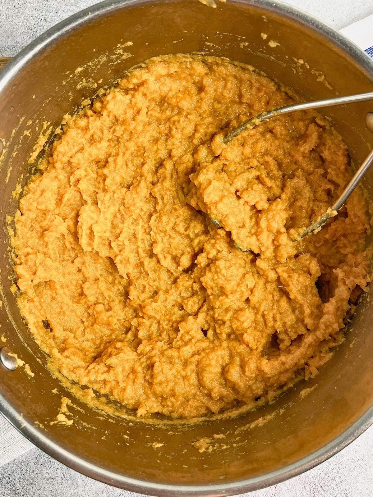 Mashed sweet potatoes with the butter, milk, and maple syrup stirred in.