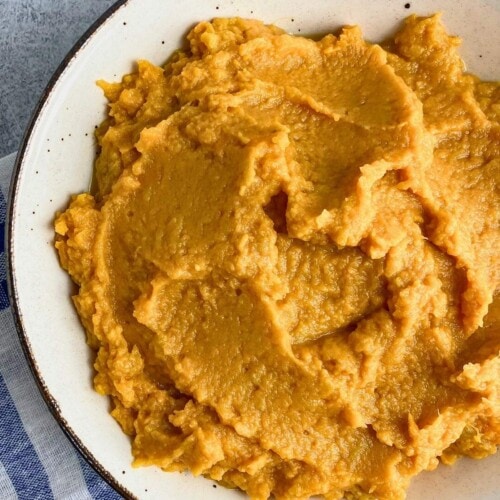 A serving bowl of homemade maple mashed sweet potatoes.