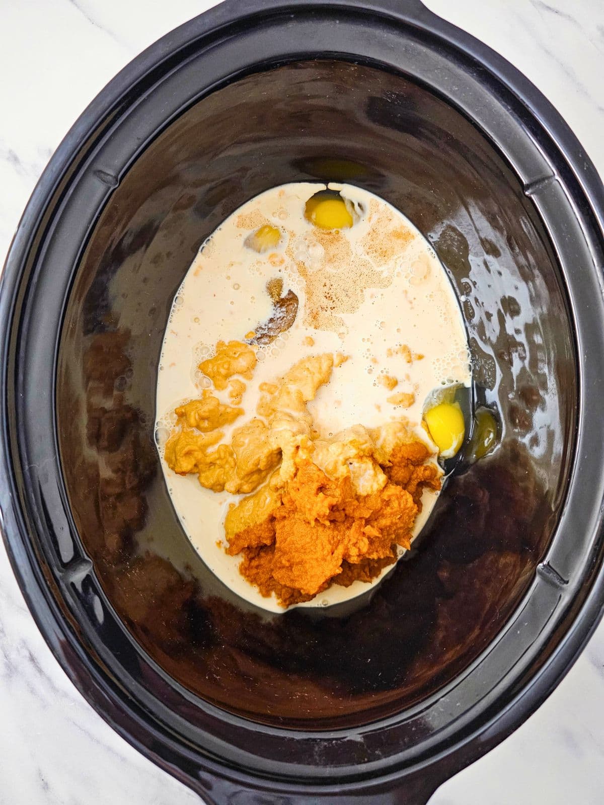 Milk was added to the ingredients in the slow cooker.