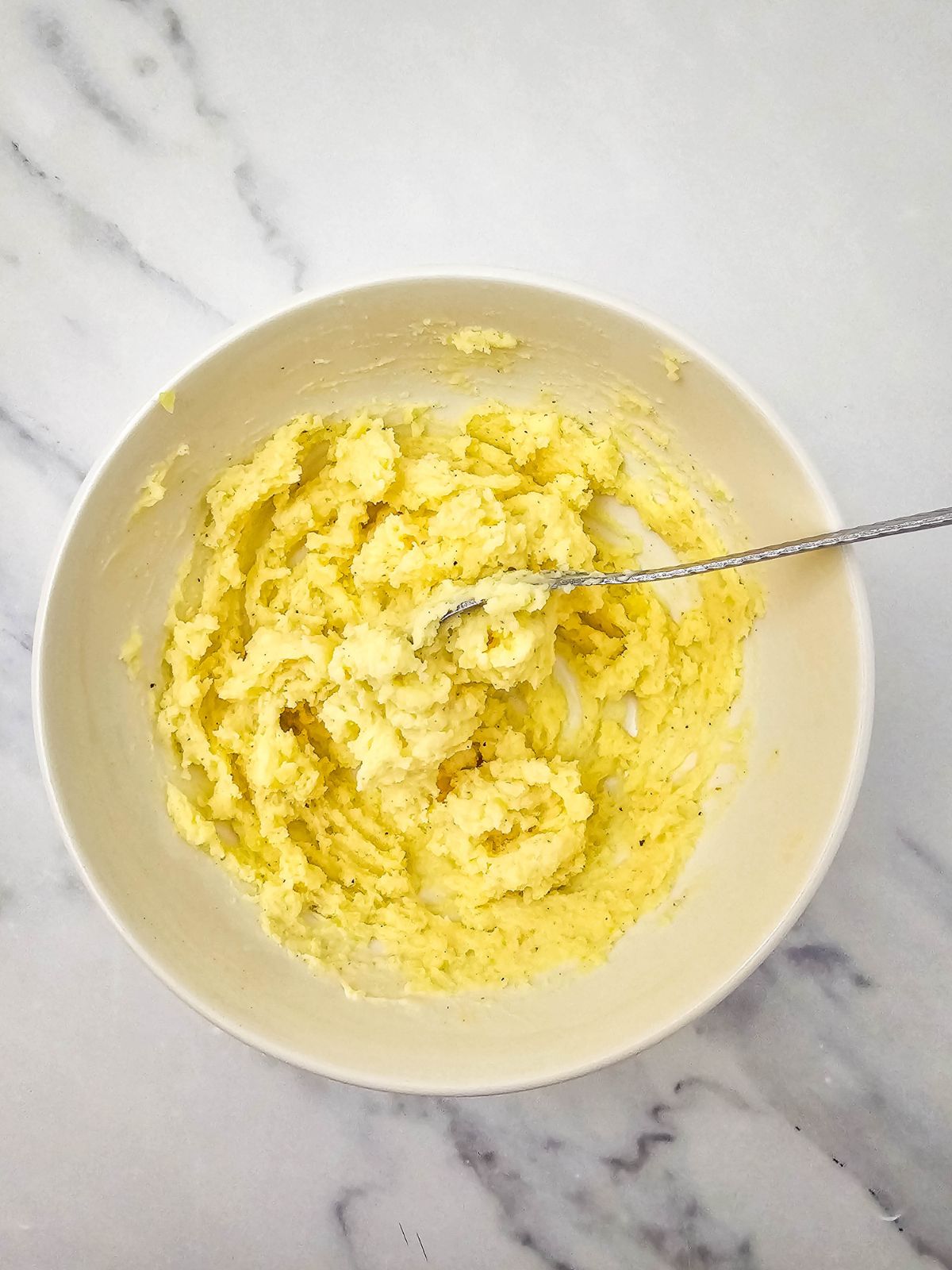 Deviled potato filling is mixed together.