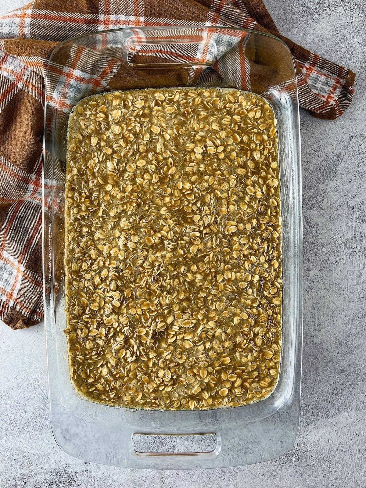 The oatmeal batter was poured into the prepared baking dish.
