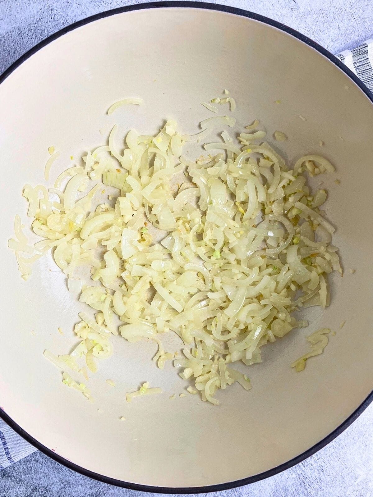 The onions and garlic are cooked in the pot.