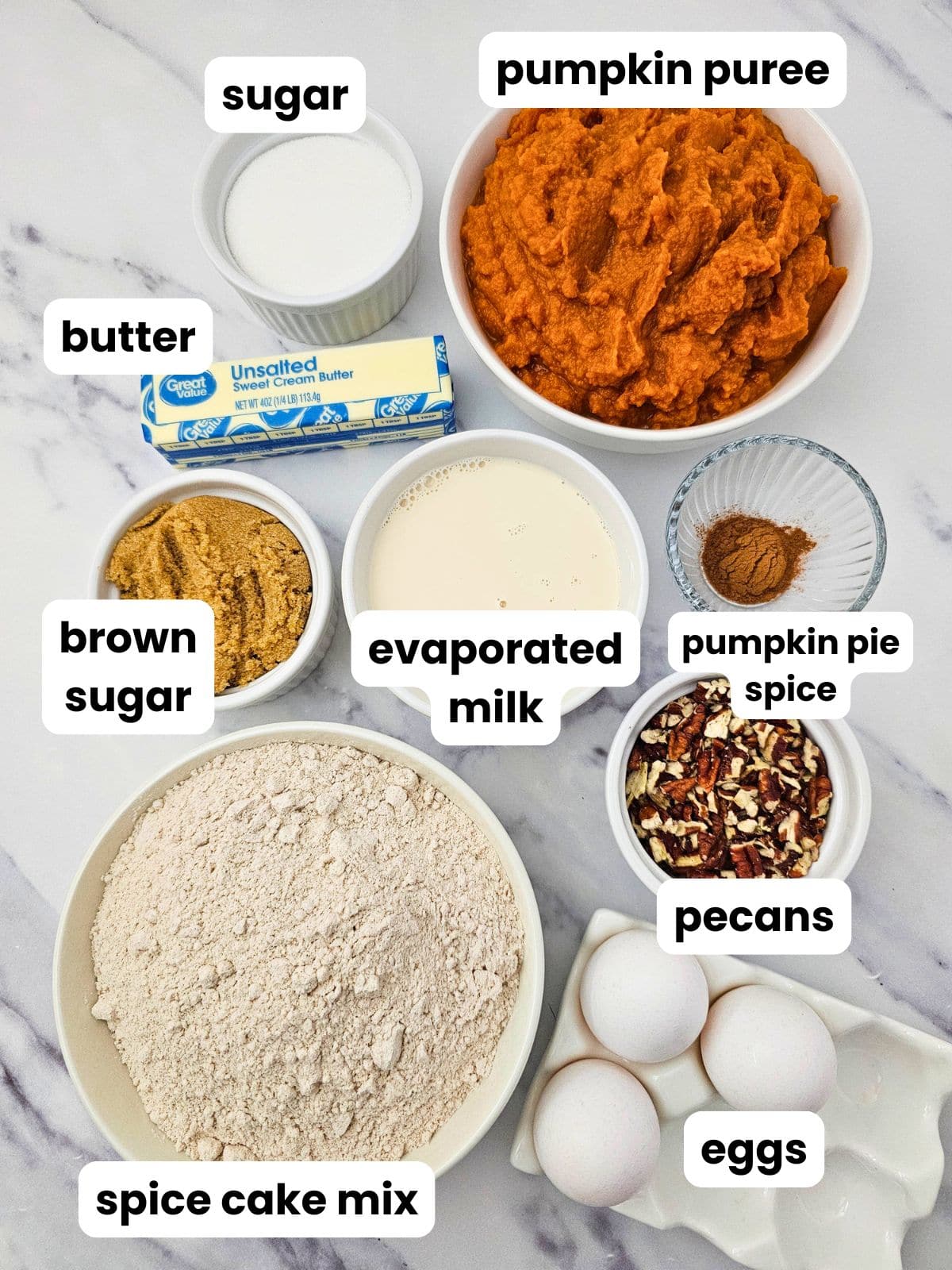 Ingredients for making pumpkin dump cake in the slow cooker.