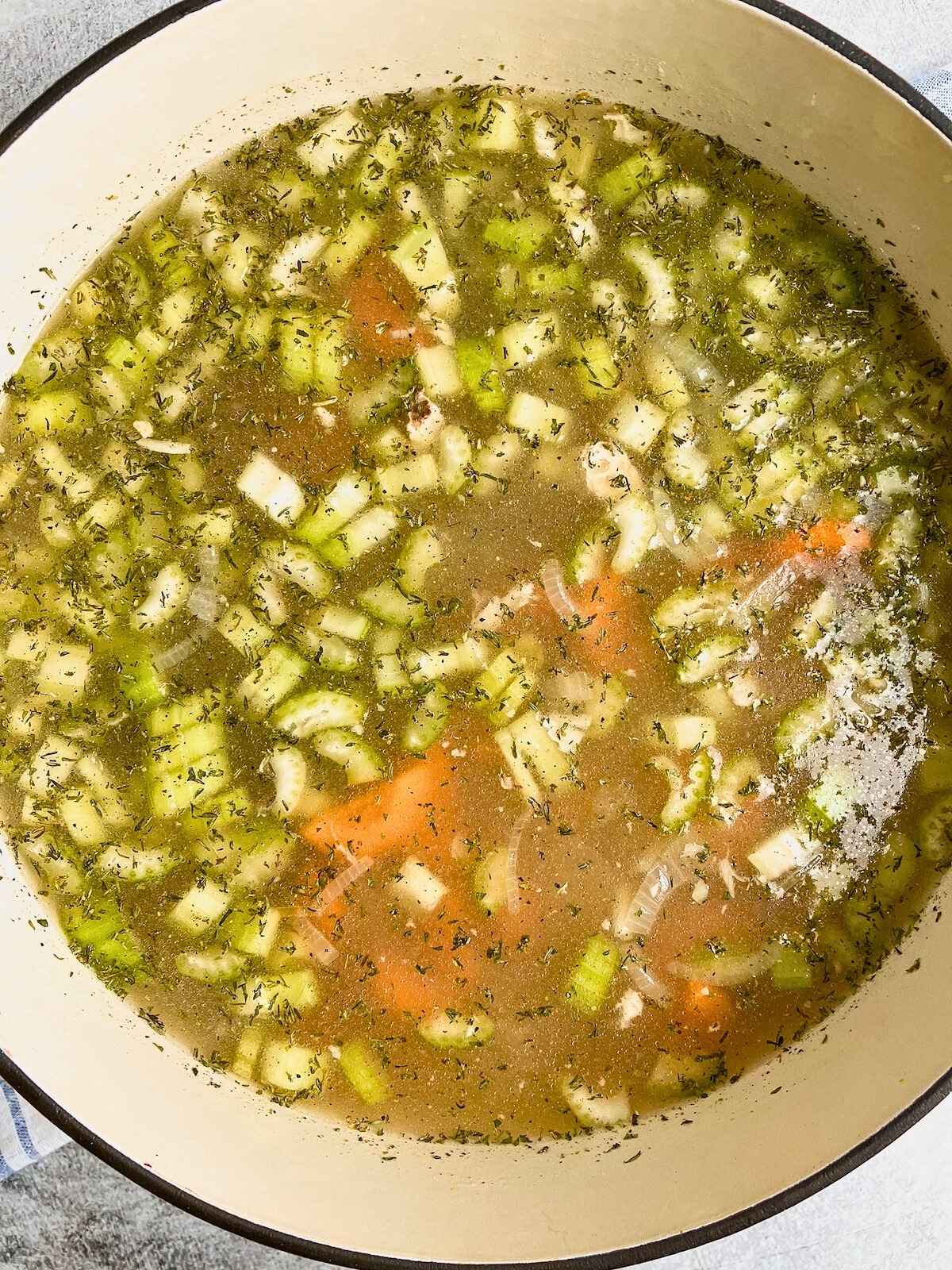 Soup ingredients are stirred together.