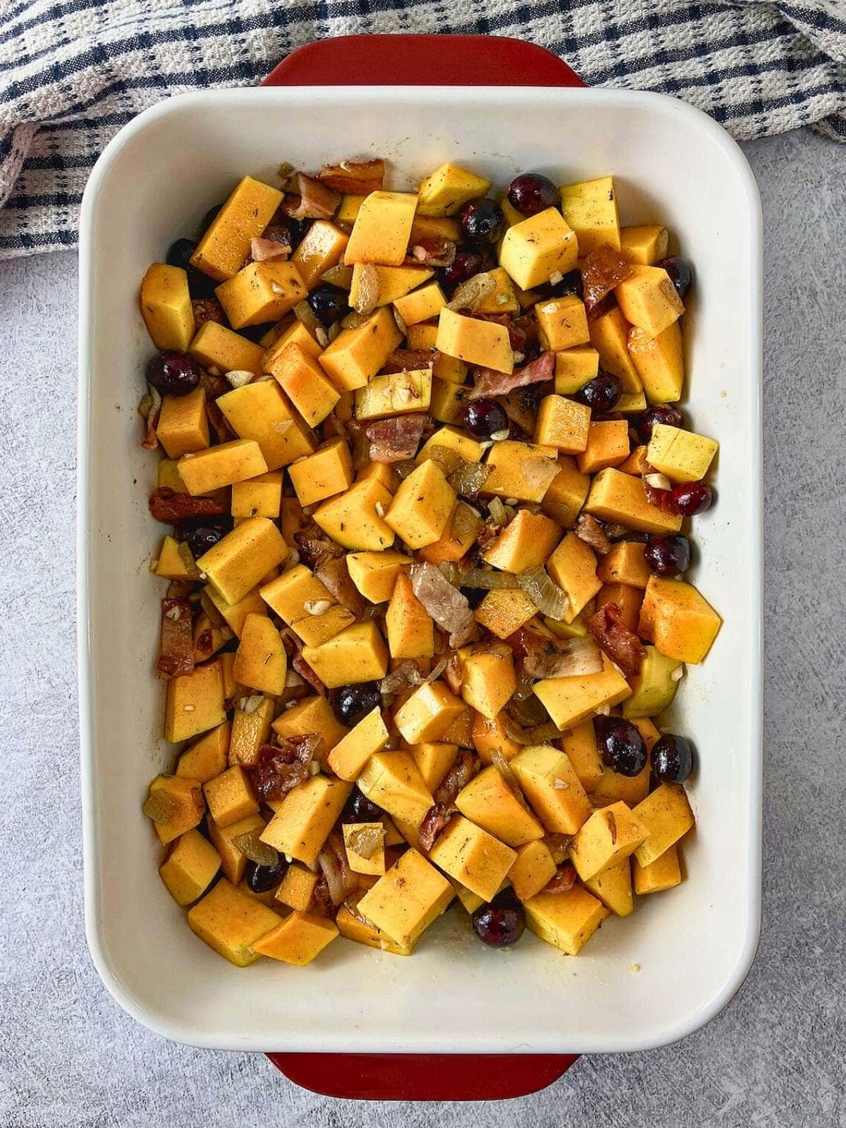 The squash filling has been spread into a casserole dish.