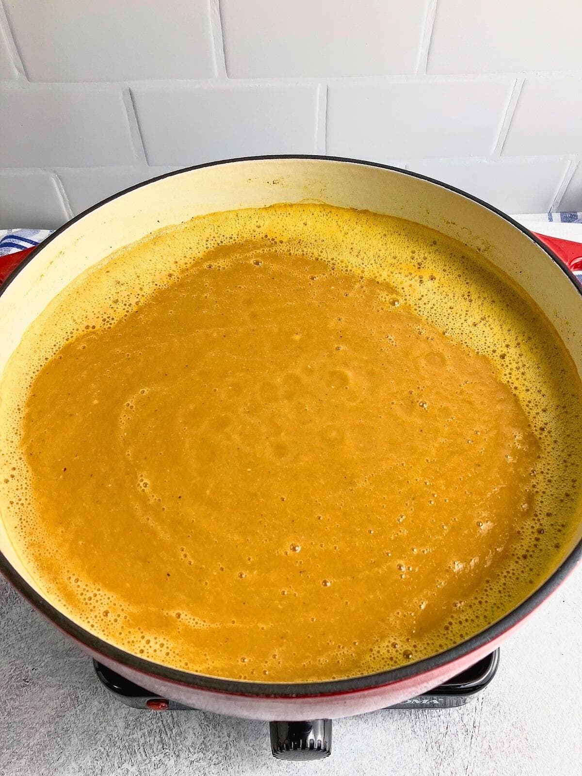 Sweet potato and carrot soup after pureeing with an immersion blender.