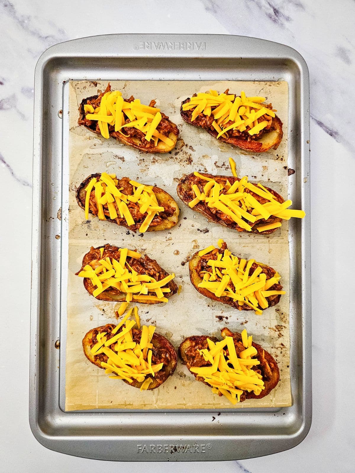 Shredded cheddar cheese was added to the top of the potatoes.