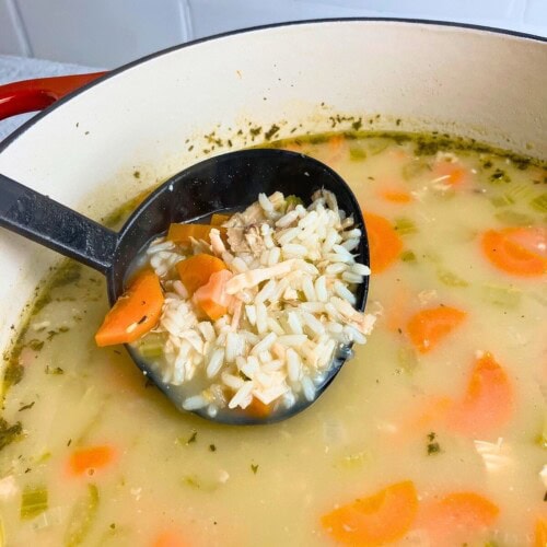 Ladling up a serving of turkey and rice soup.