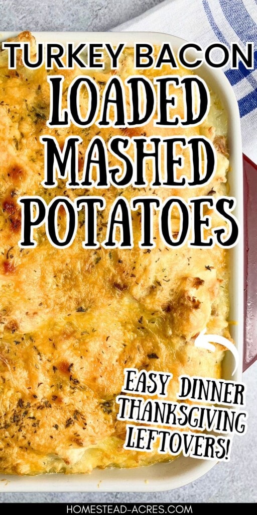 Potato casserole topped with cheese in a red and white casserole dish. The text overlay says Turkey Bacon Loaded Mashed Potatoes. Easy Dinner Thanksgiving Leftovers!