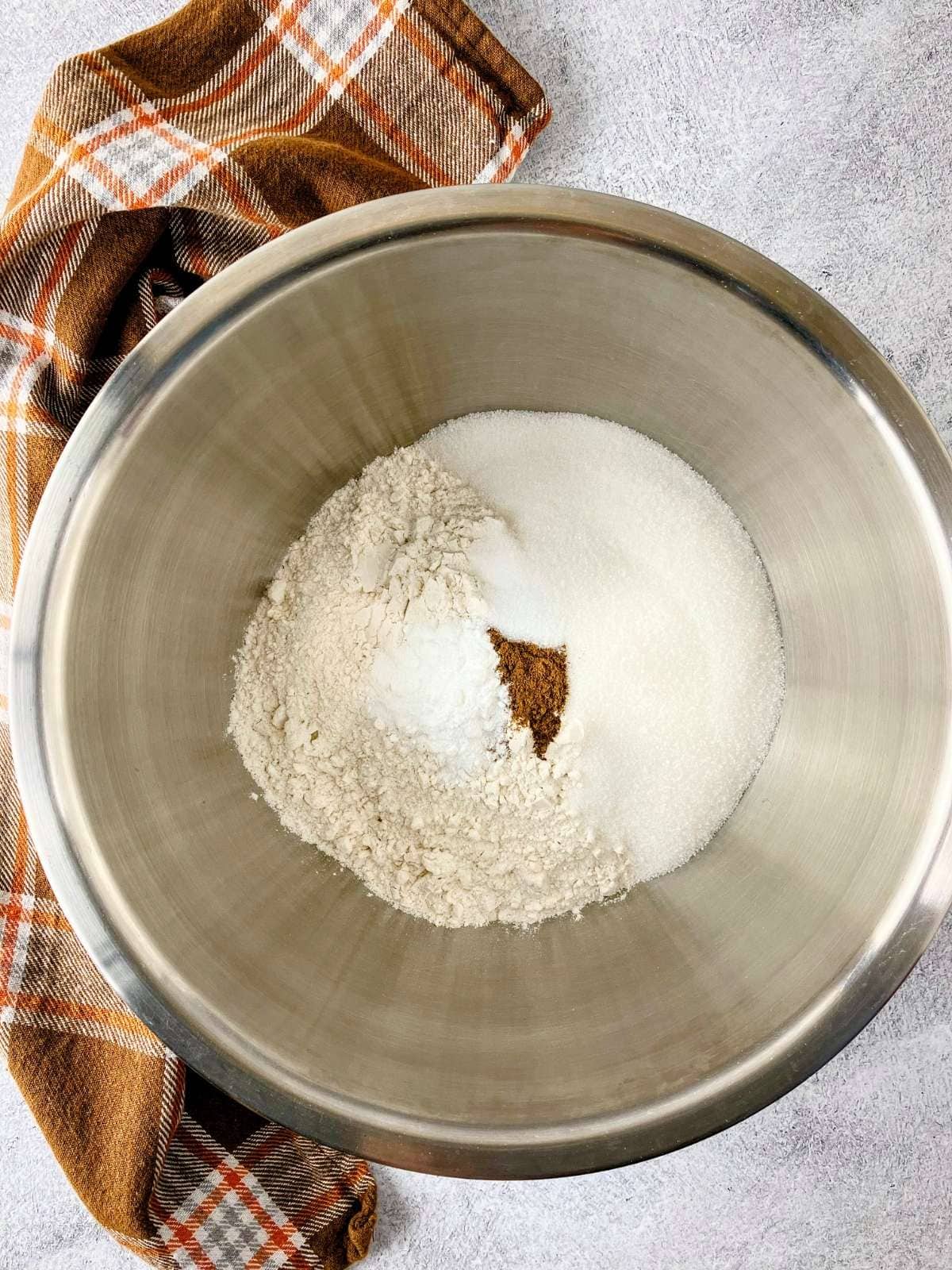 The dry ingredients for cranberry squares were measured into a mixing bowl.