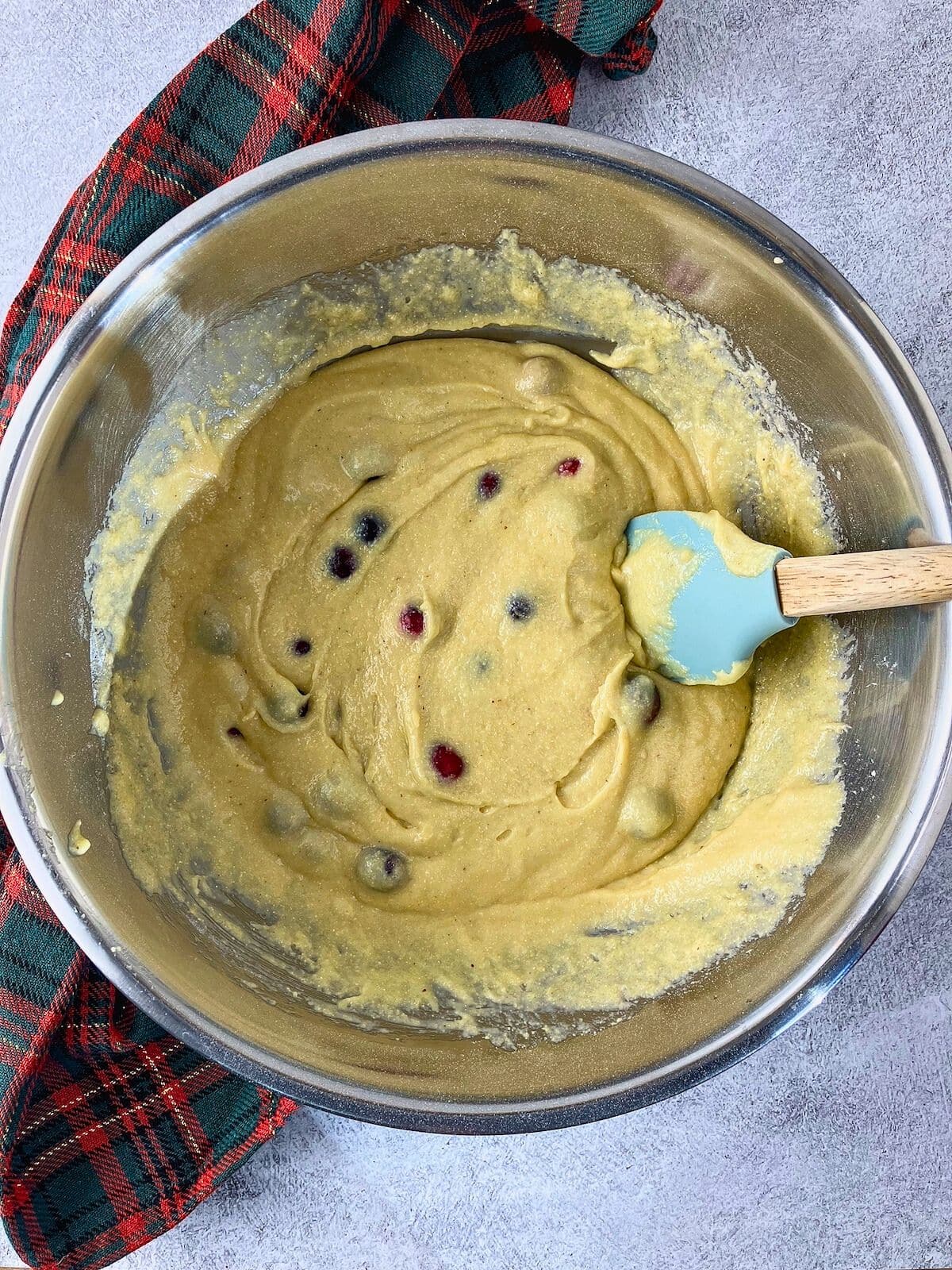 The cranberries have been folded into the batter.