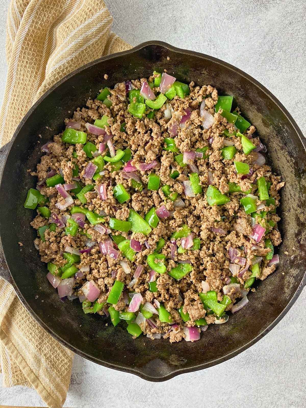 The ground beef and vegetables were cooked together.