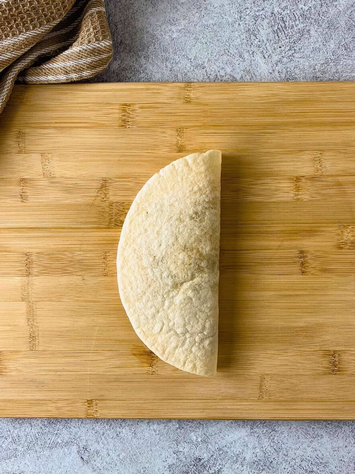 The tortilla was folded in half and is ready to fry.