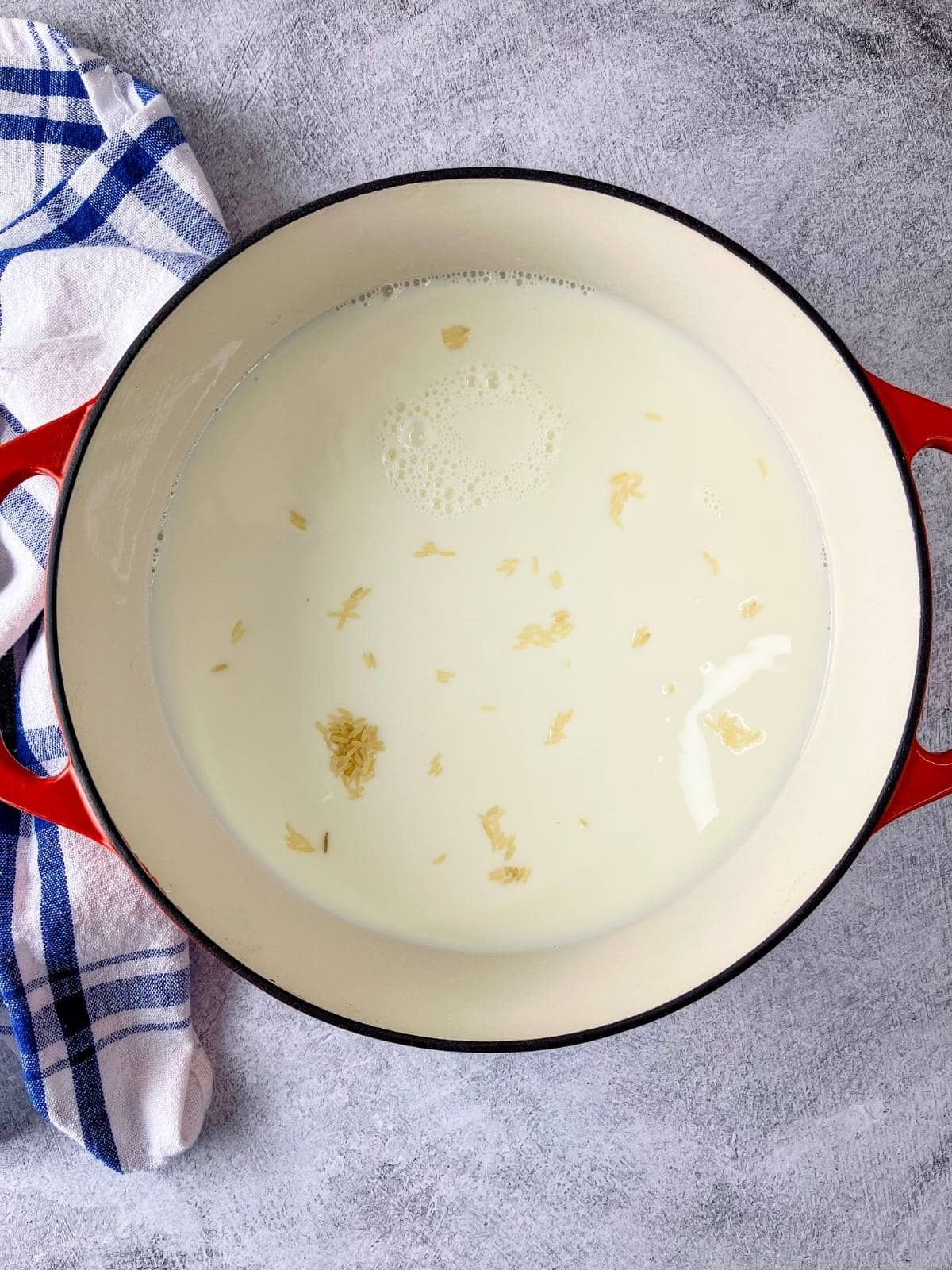 The milk was added to the uncooked rice mixture.