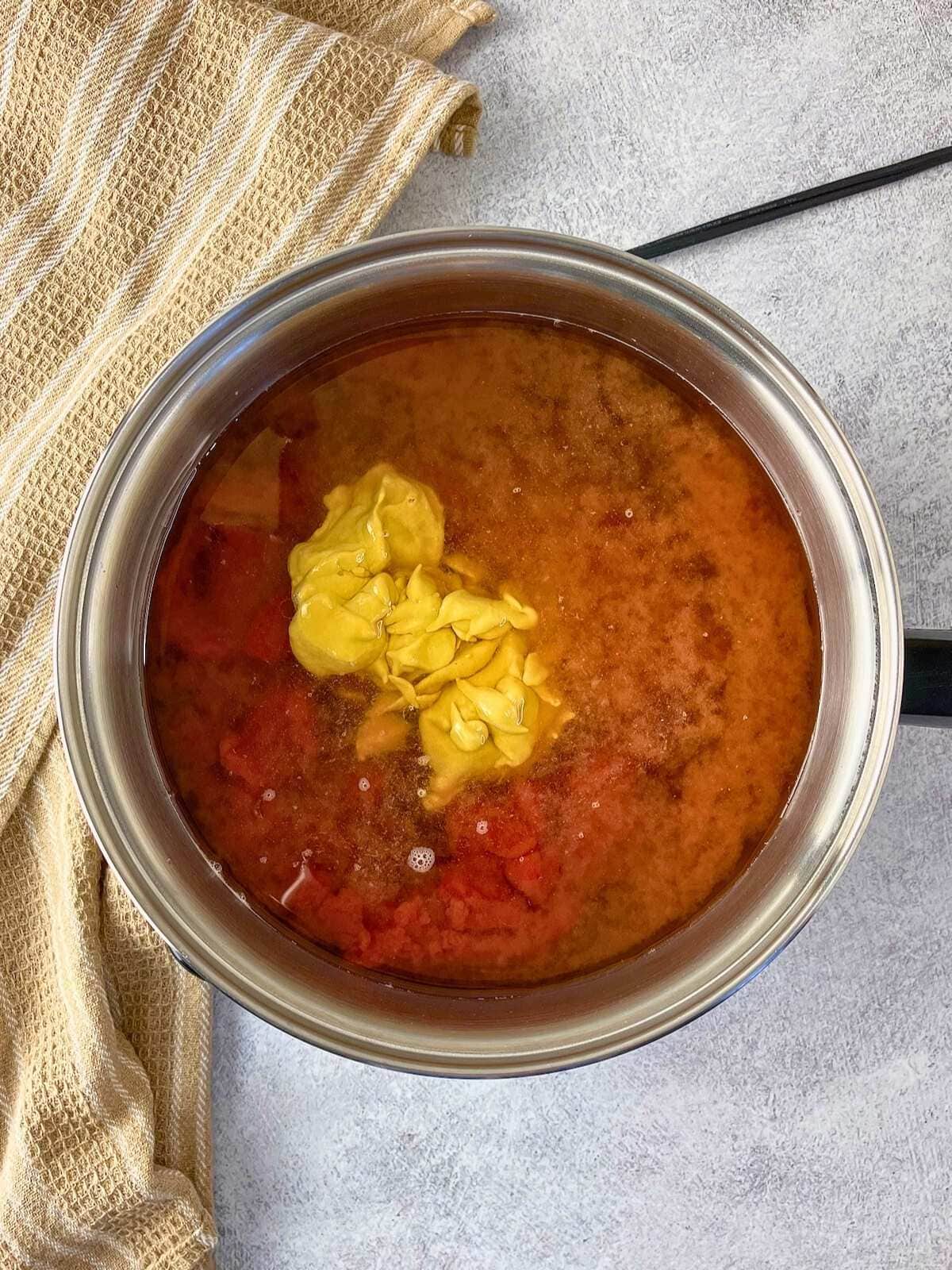 The yellow mustard and molasses were added to the sauce.