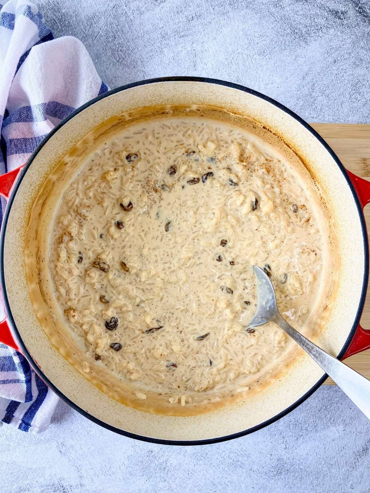 Simple homemade rice pudding in a cast iron Dutch oven.